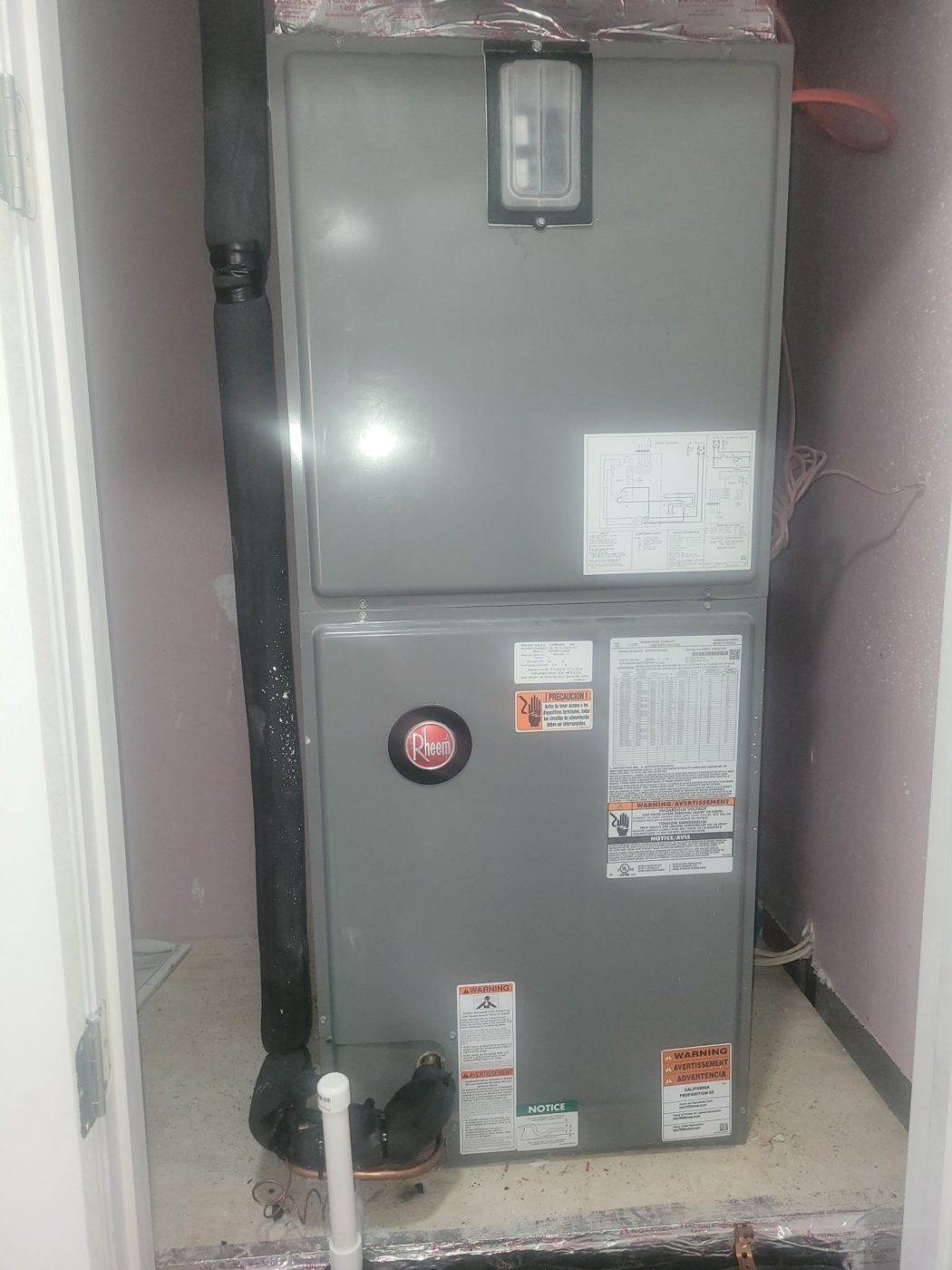 New Rheem air handler installed in a closet