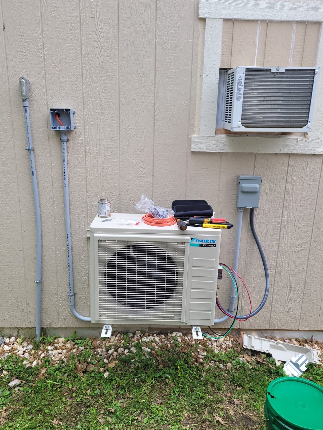 Daikin mini-split outdoor unit being installed