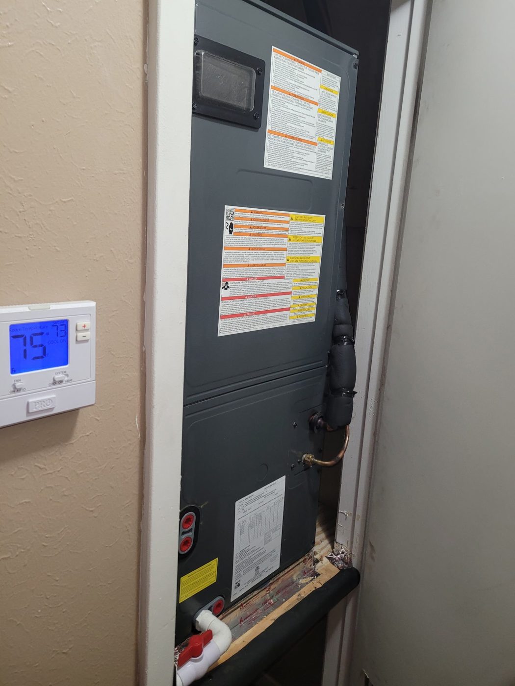 New air handler with thermostat set to 75 degrees